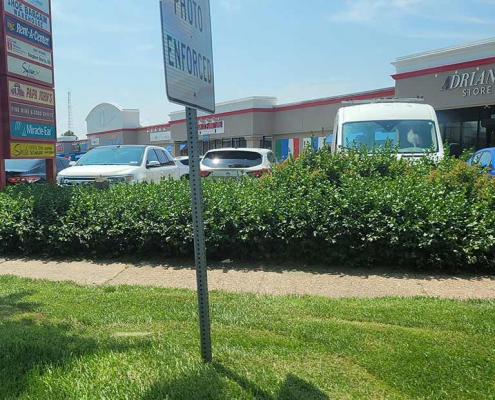 Parked cars in a strip mall parking lot in Northeast Philly where Cash for home in Tacony is a popular selling method