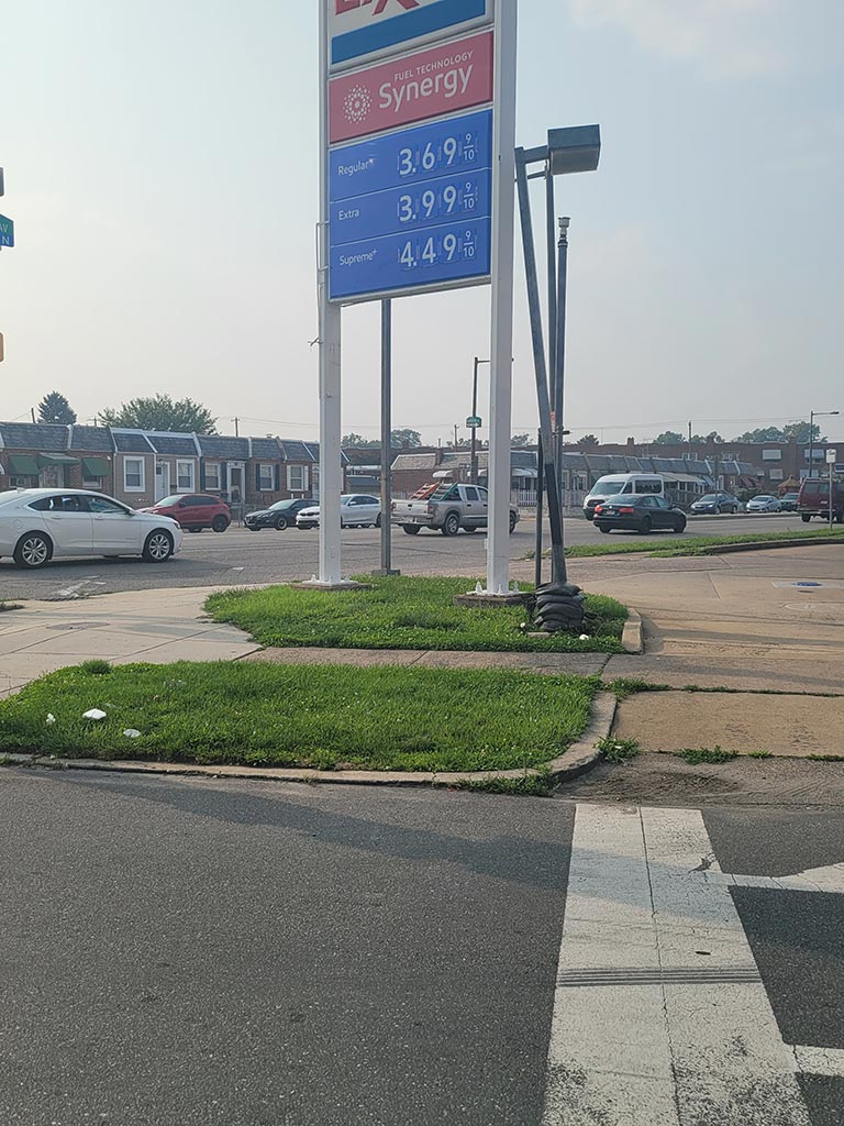 View of street as one exits from Exxon gas station into traffic. In a housing market with high interest rates using cash for a home in wissinoming can get sales done faster and close quickly