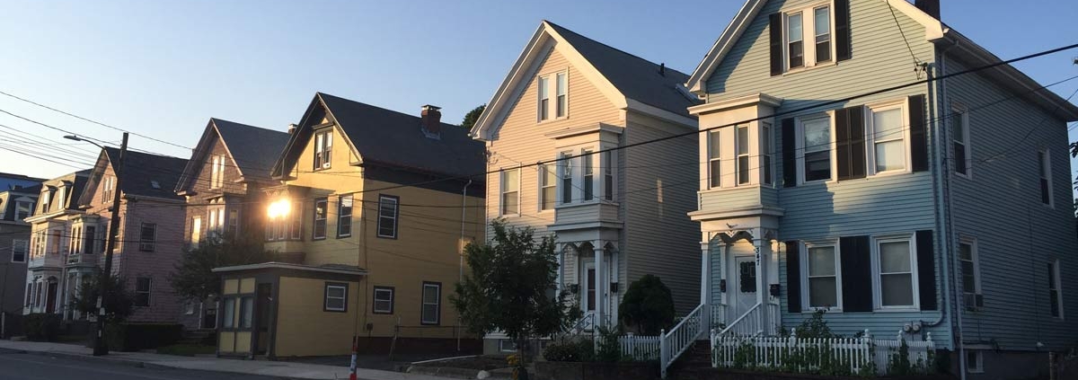 photograph of a row of houses for sale in Philly. Joey Loves Philly buys houses for cash.