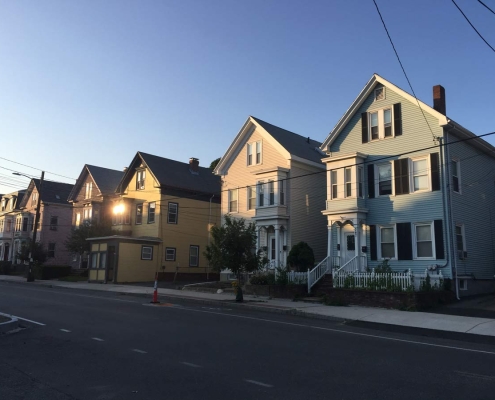 photograph of a row of houses for sale in Philly. Joey Loves Philly buys houses for cash.