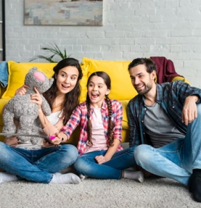 A family taking selfie photos. They just got cash for a home in Philadelphia.