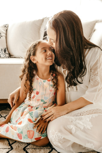 Mother and daughter sitting in the living room of their Bustleton neighborhood home. Many people are looking to sell their home for cash to Joey Loves Philly in Bustleton.