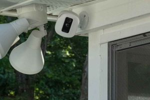 Security camera above door at vacant houses. Asking Cash for house in Philly helps sell homes faster than traditional sales.